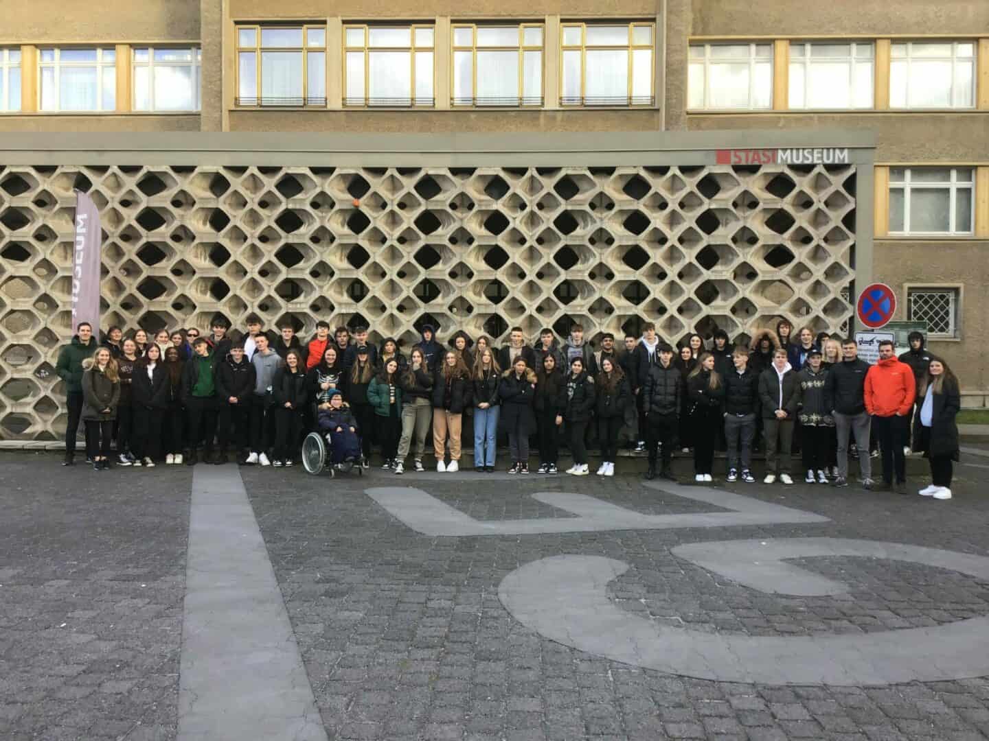 Students stand in front of the Stasi Museum