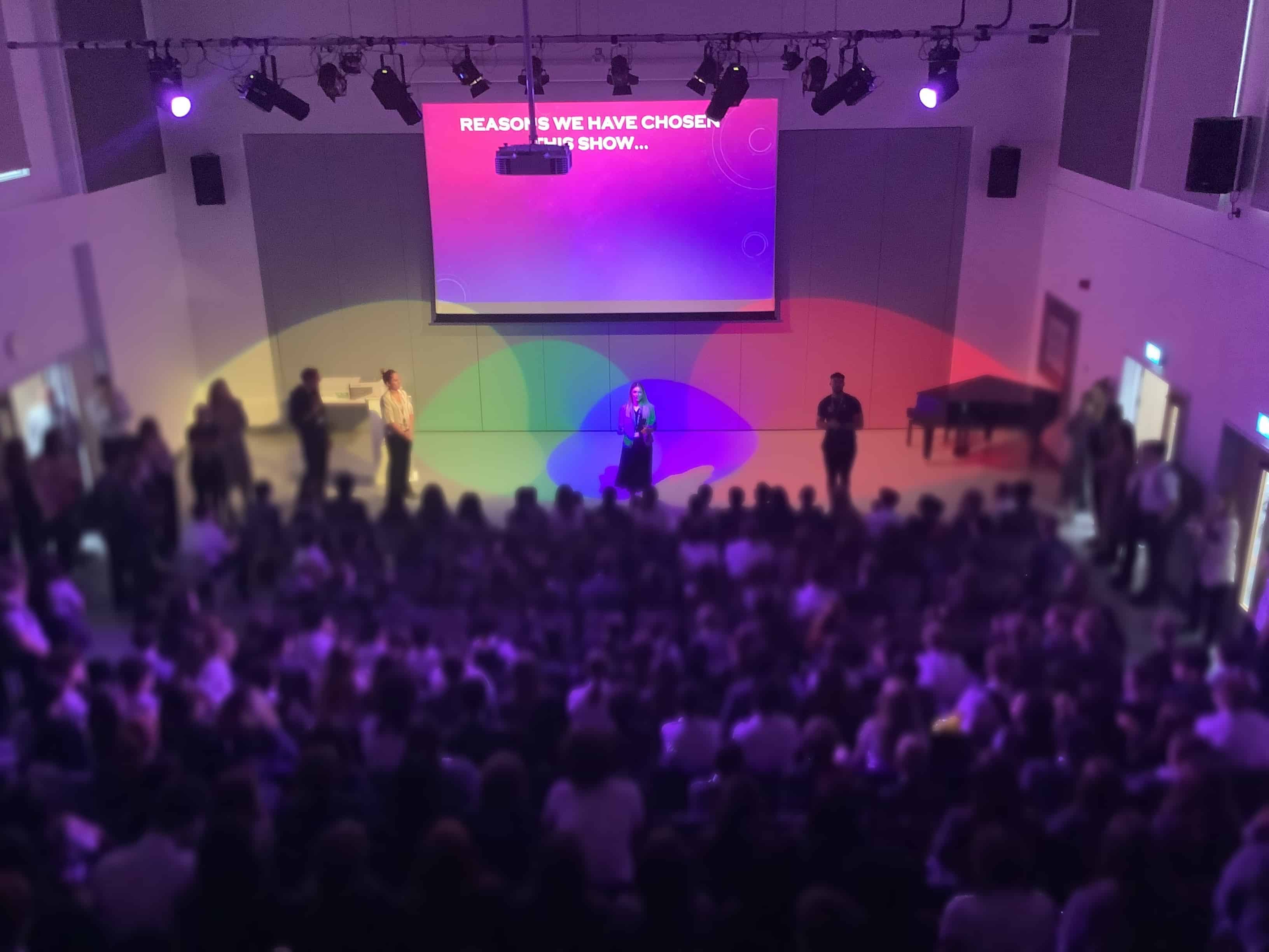 Students from Laurus Cheadle Hulme wait in the hall to hear what the next year's school show will be