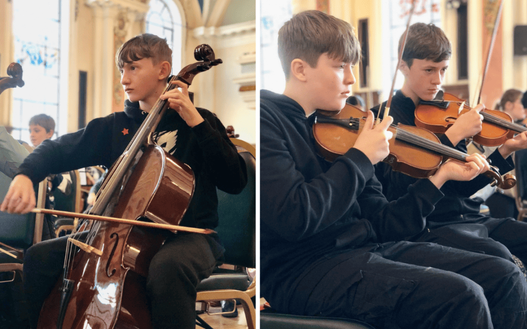 Laurus Cheadle Hulme students play instruments at Benedetti Foundation Strings Day at Stockport Town Hall.
