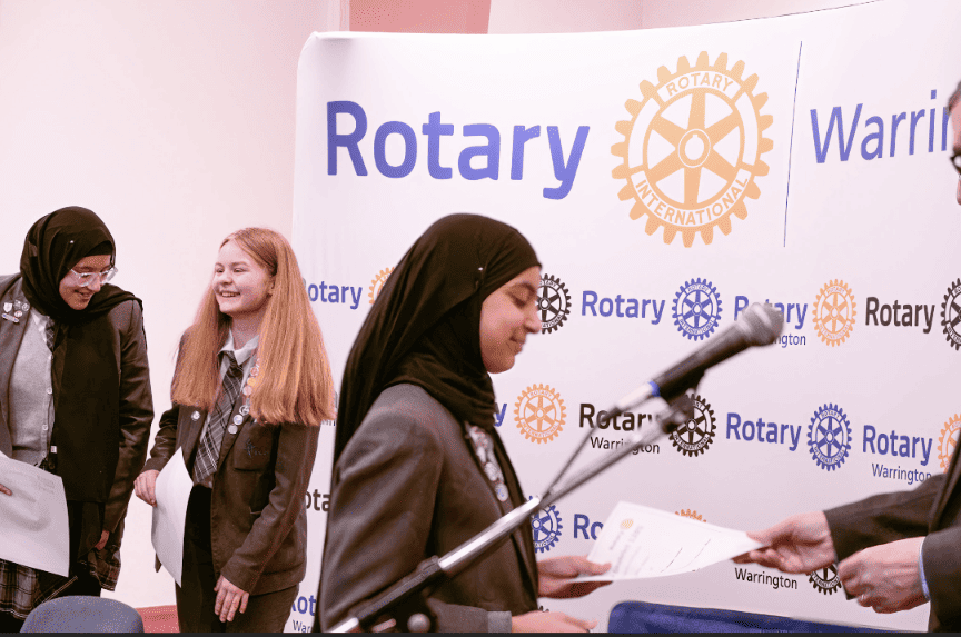 Laurus Cheadle Hulme students collect certificates at the Rotary Youth Speaks District Heats in Warrington.
