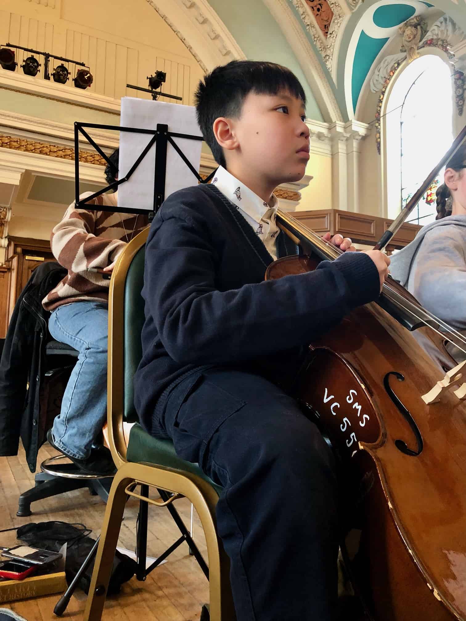 A student from Laurus Cheadle Hulme plays his string instrument at the Benedetti Strings day at Stockport Town Hall.